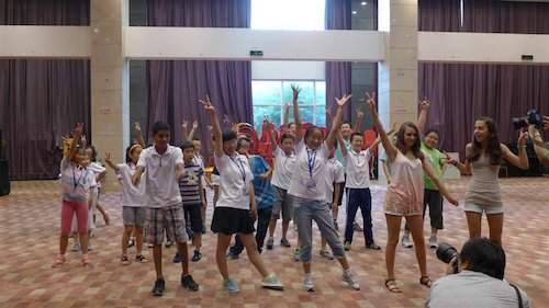 Children dance at the Bluestar International Summer Camp. [Women of China/Yao Yao]