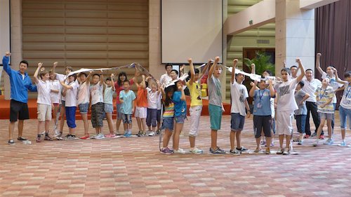 Children participate in a group activity at the Bluestar International Summer Camp. [Women of China/Yao Yao]