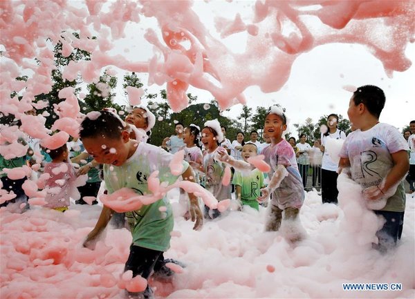 Children Play with Bubbles at Scenic Spot in SW China