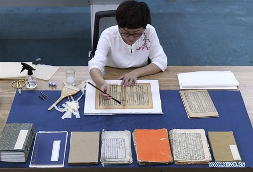 Teacher Restores Over 1,000 Ancient Books in 13-year Career