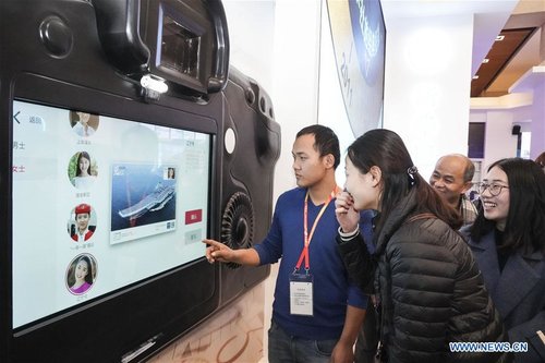 Visitors View Exhibition Commemorating China's Reform, Opening-up