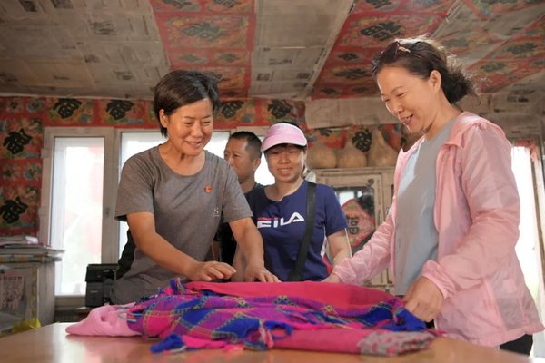 Woman Official Records Villagers' Improved Lives Through Her Lens