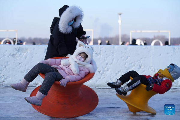 People Enjoy Ice-Snow Fun in Harbin