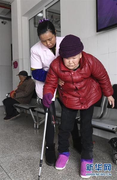 Woman Attendant Provides Considerate Nursing Services to Disabled Elderly
