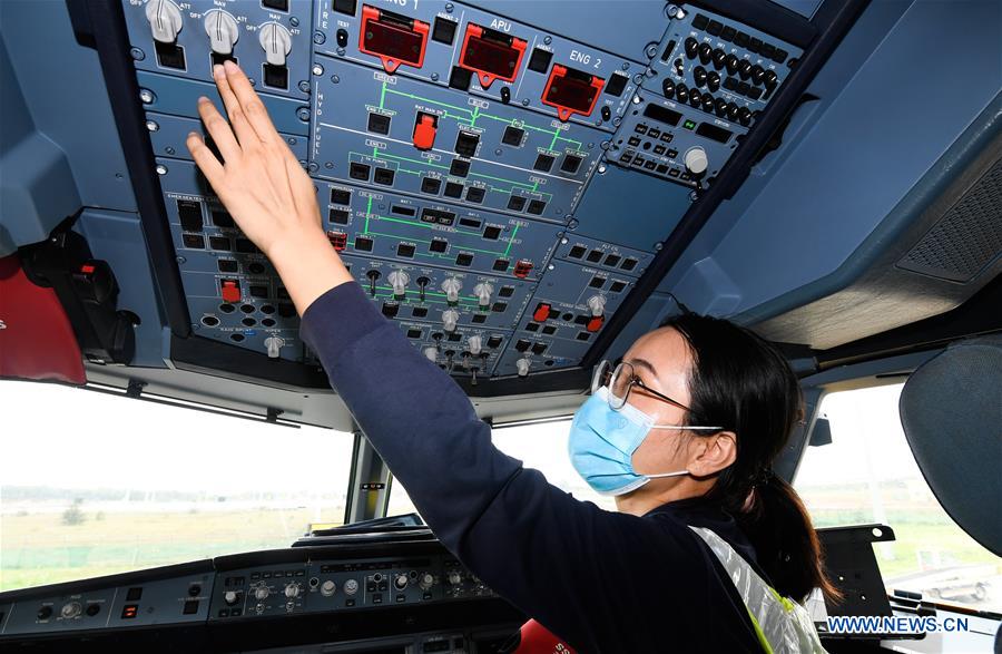 Female Maintenance Engineer Works at Haikou Int'l Airport