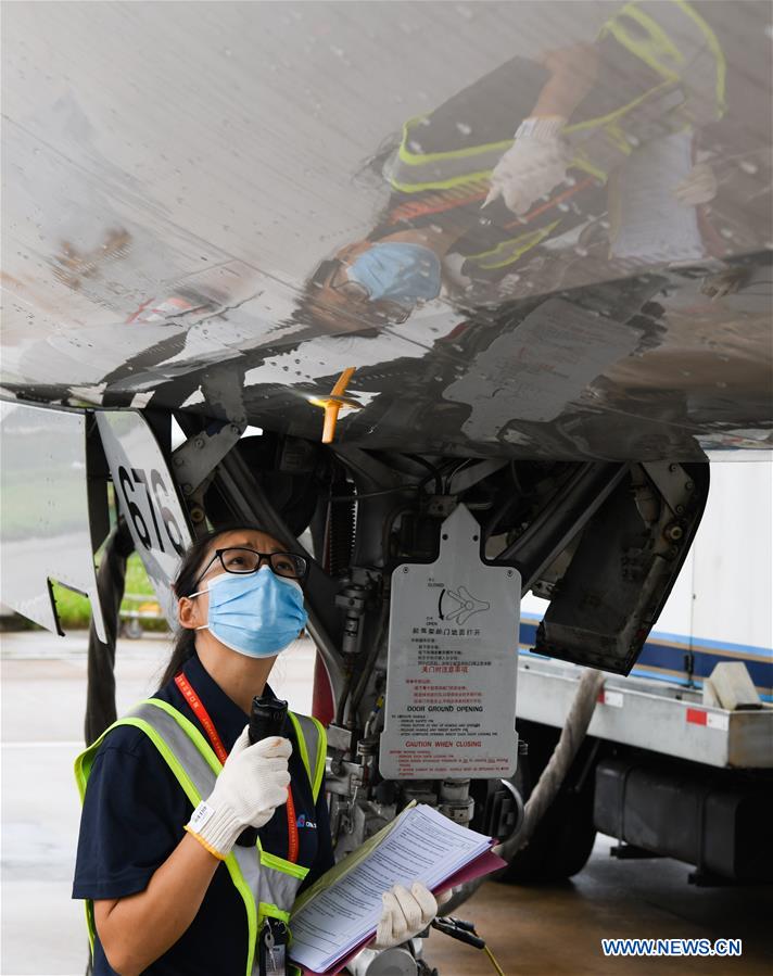 Female Maintenance Engineer Works at Haikou Int'l Airport
