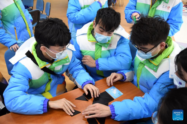 Volunteers for Beijing Olympics Attend Training Session to Develop Skills