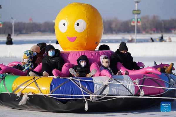 People Enjoy Ice-Snow Fun in Harbin