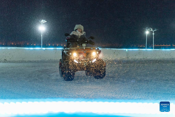 People Enjoy Themselves at Winter Recreation Park in Harbin