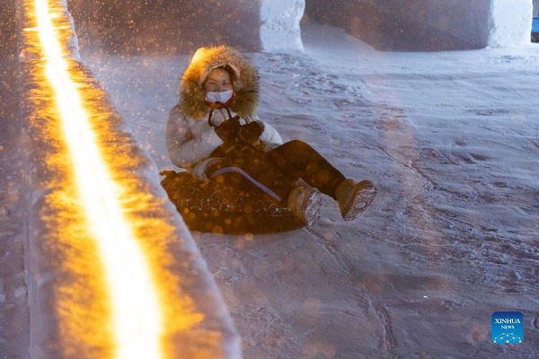 People Enjoy Themselves at Winter Recreation Park in Harbin