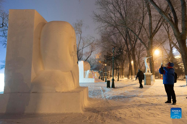 People Enjoy Themselves at Winter Recreation Park in Harbin