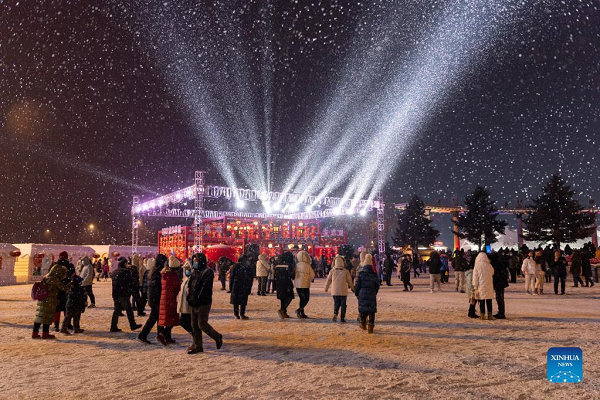 People Enjoy Themselves at Winter Recreation Park in Harbin
