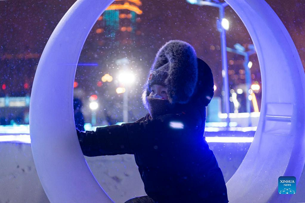 People Enjoy Themselves at Winter Recreation Park in Harbin