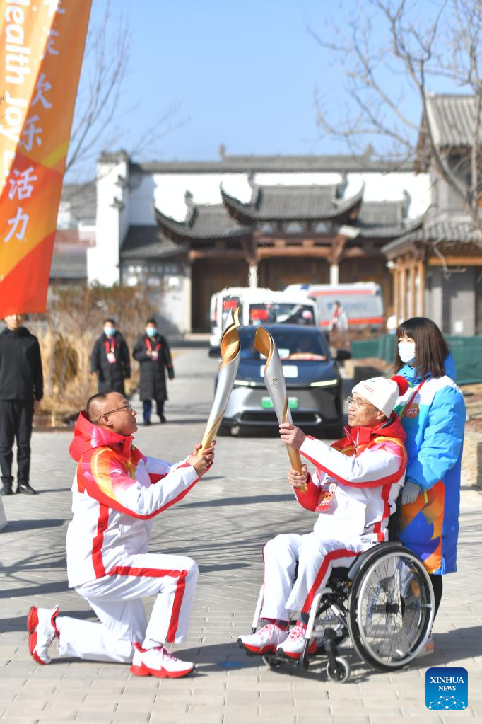 Winter Paralympic Torch Relay Held in Beijing's Olympic Forest Park