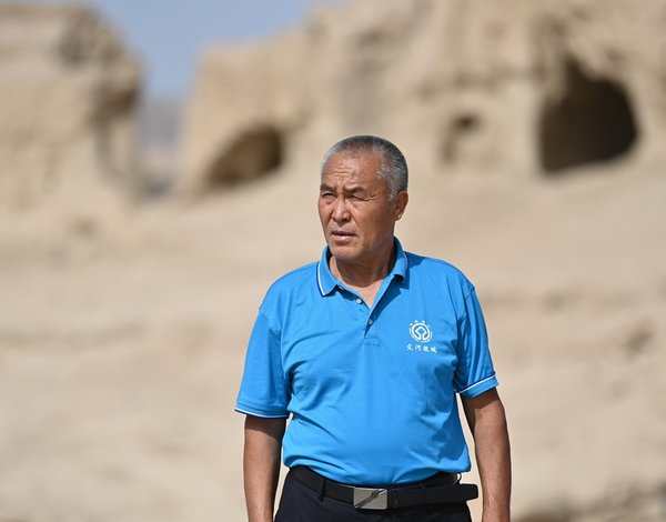 Three Generations of Uygur Family Devoted to Protecting Ancient Buddhist City
