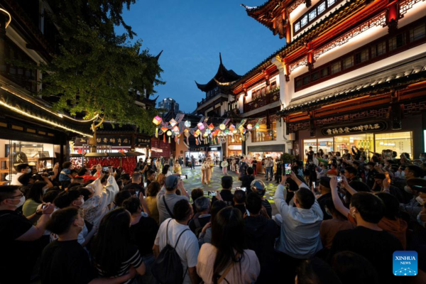 People Enjoy Traditional Performance at Yuyuan Garden Shopping Mall in Shanghai