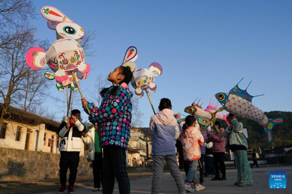 Tourists Take Part in Lantern Parade to Celebrate Chinese New Year in E China's Anhui