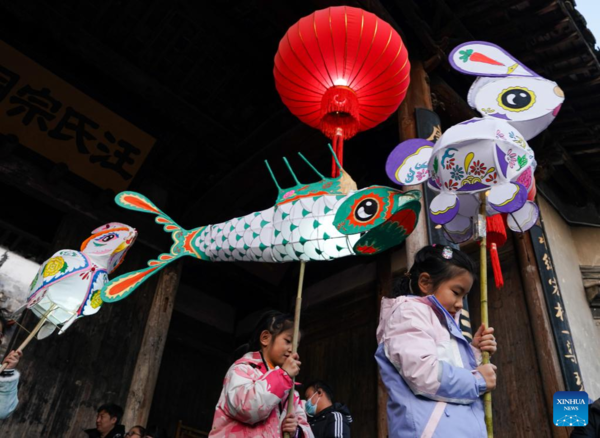 Tourists Take Part in Lantern Parade to Celebrate Chinese New Year in E China's Anhui