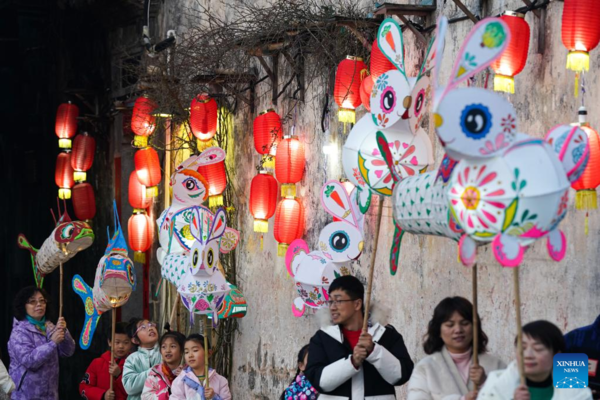 Tourists Take Part in Lantern Parade to Celebrate Chinese New Year in E China's Anhui