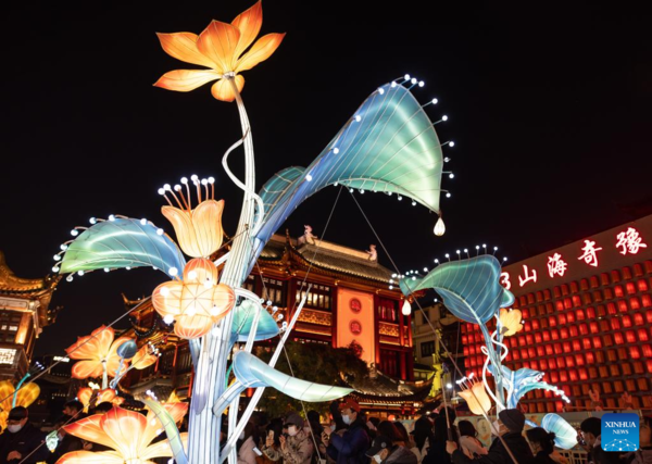 People Watch Lantern Show at Yu Garden in Shanghai