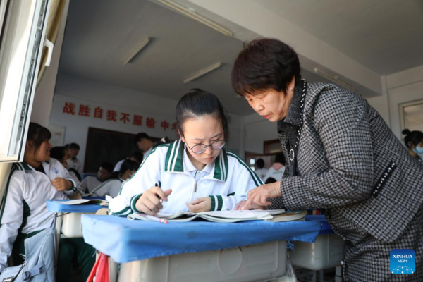 Mother Accompanies Daughter in Studying at School