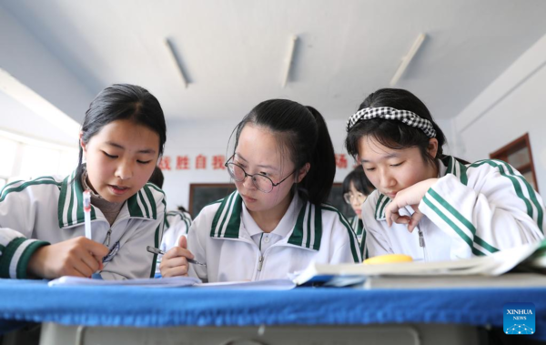 Mother Accompanies Daughter in Studying at School