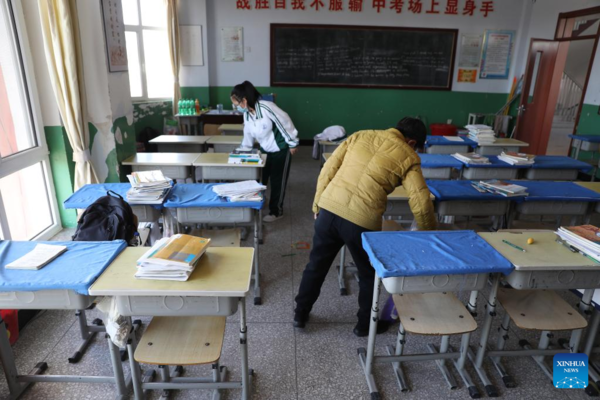 Mother Accompanies Daughter in Studying at School