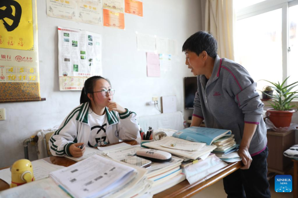 Mother Accompanies Daughter in Studying at School