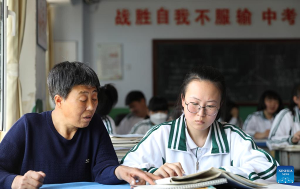 Mother Accompanies Daughter in Studying at School