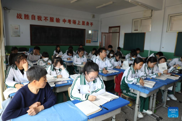 Mother Accompanies Daughter in Studying at School