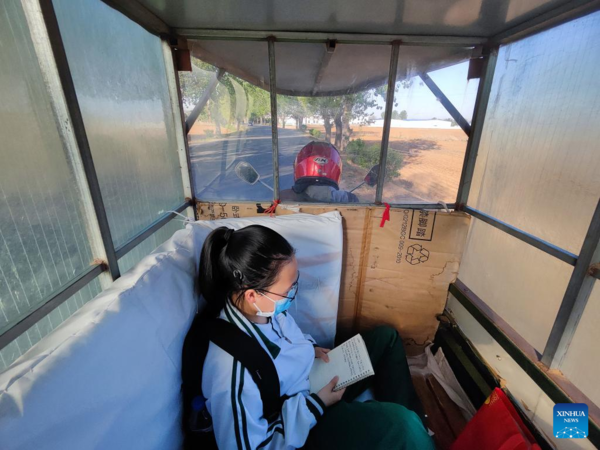 Mother Accompanies Daughter in Studying at School