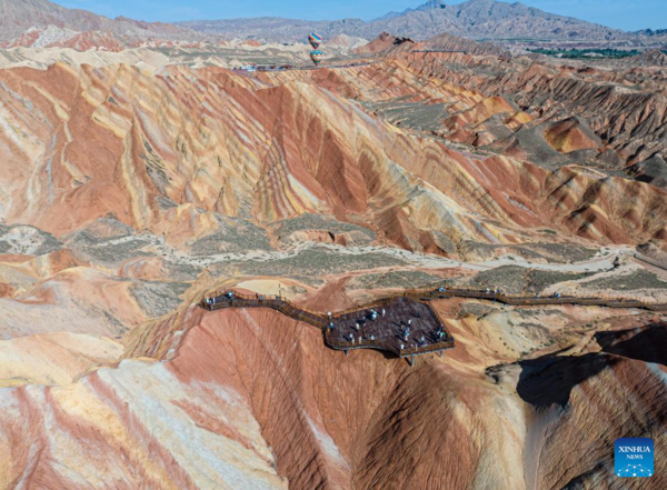 Danxia National Geological Park in NW China Attracts Tourists with Unique Landscape