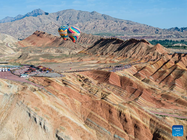 Danxia National Geological Park in NW China Attracts Tourists with Unique Landscape