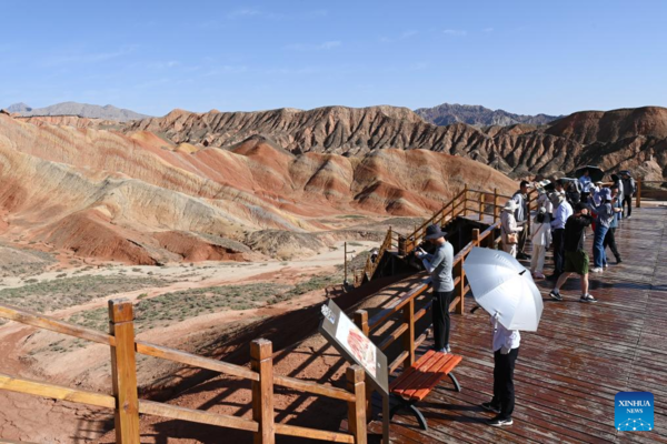 Danxia National Geological Park in NW China Attracts Tourists with Unique Landscape