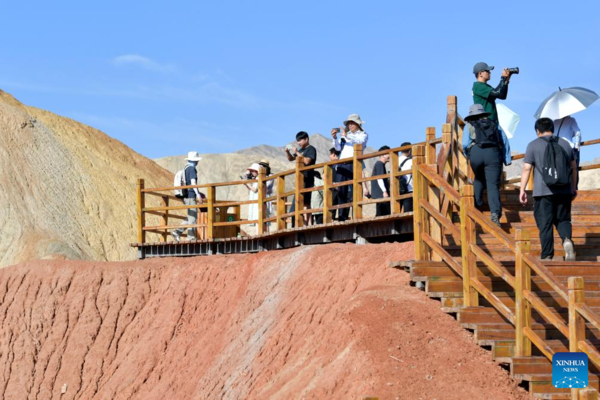 Danxia National Geological Park in NW China Attracts Tourists with Unique Landscape