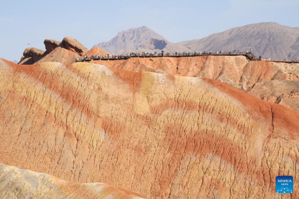 Danxia National Geological Park in NW China Attracts Tourists with Unique Landscape