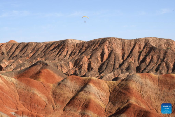 Danxia National Geological Park in NW China Attracts Tourists with Unique Landscape