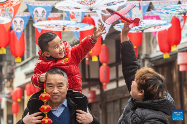 Decorations Set up to Celebrate Upcoming Spring Festival in Yongxi Ancient Town, SW China