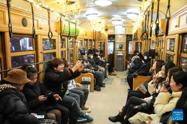Trams Decorated with Lights to Attract Tourists in Dalian, China's Liaoning