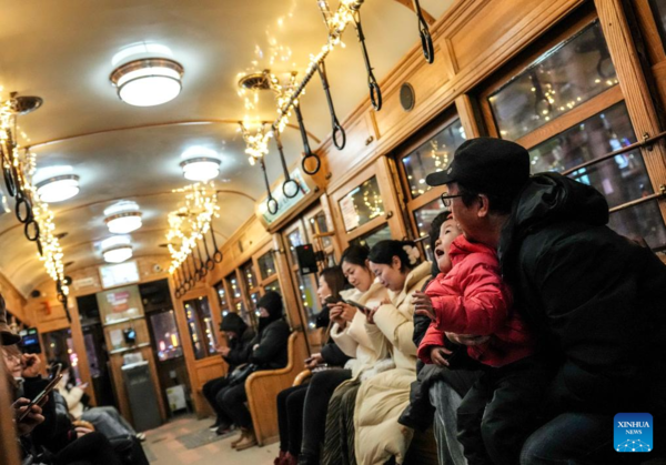 Trams Decorated with Lights to Attract Tourists in Dalian, China's Liaoning