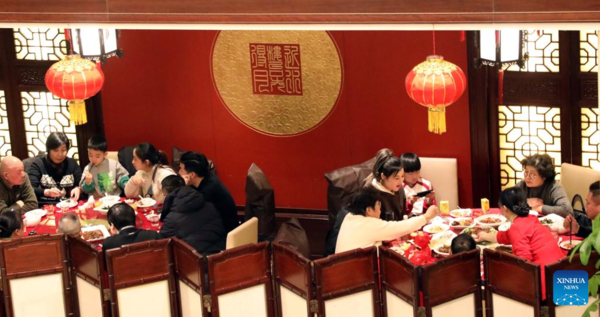 People Across China Have Family Reunion Dinners on Chinese Lunar New Year's Eve