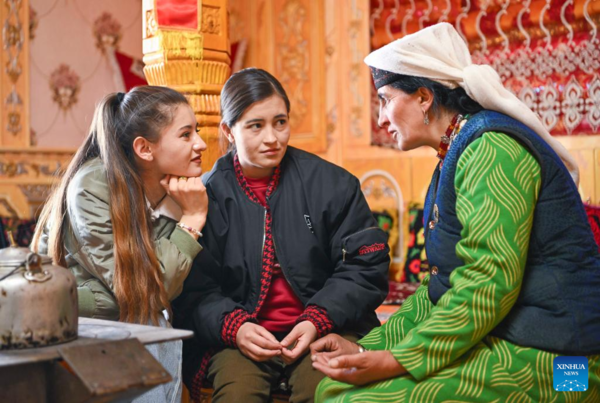 Ethnic Charm of Young Dancer Glows on Stage of Pamir Plateau