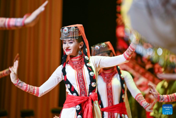 Ethnic Charm of Young Dancer Glows on Stage of Pamir Plateau
