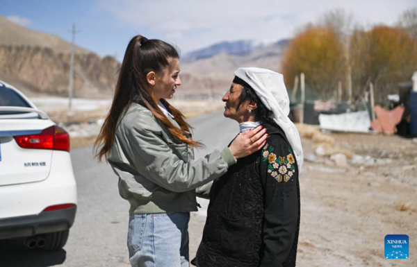 Ethnic Charm of Young Dancer Glows on Stage of Pamir Plateau