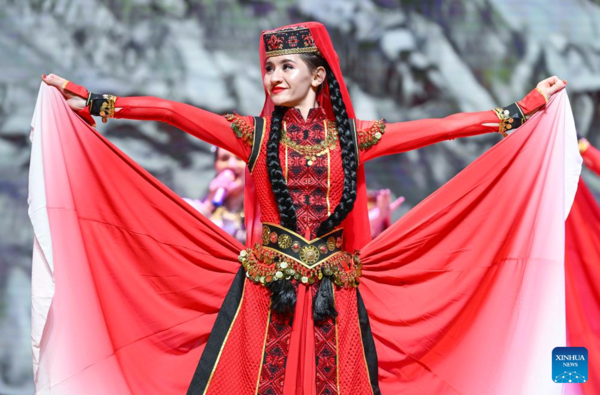 Ethnic Charm of Young Dancer Glows on Stage of Pamir Plateau