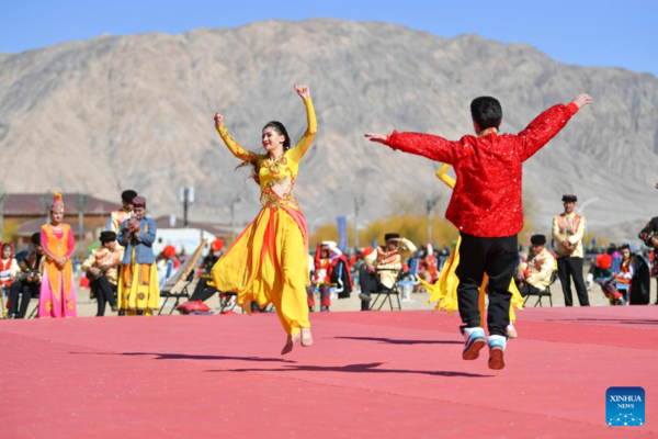Ethnic Charm of Young Dancer Glows on Stage of Pamir Plateau