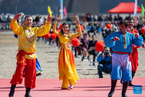 Ethnic Charm of Young Dancer Glows on Stage of Pamir Plateau