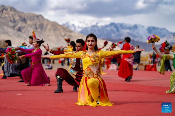 Ethnic Charm of Young Dancer Glows on Stage of Pamir Plateau