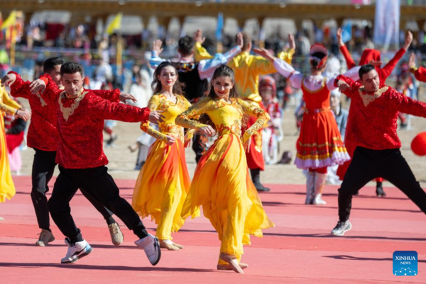 Ethnic Charm of Young Dancer Glows on Stage of Pamir Plateau